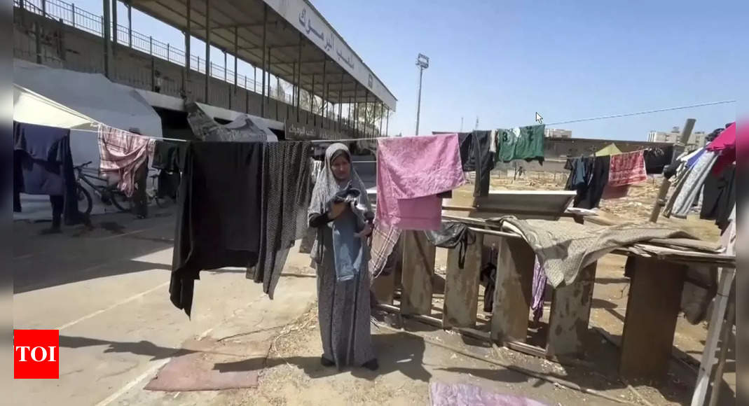 Gaza's biggest soccer stadium is now a shelter for thousands of displaced Palestinians - Times of India