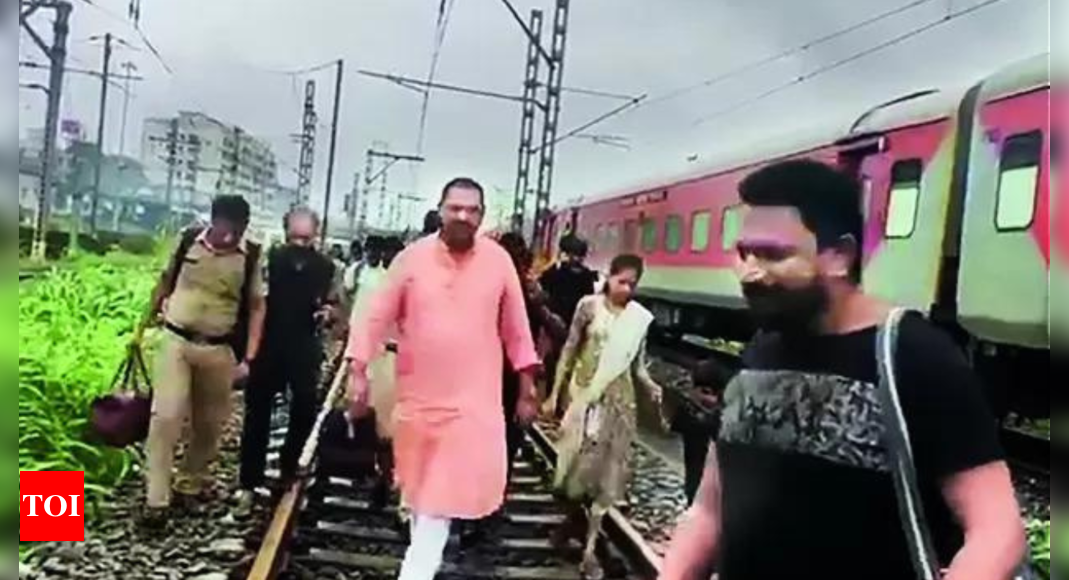 Netas get taste of aam aadmi woes, alight from trains, trudge on tracks | India News