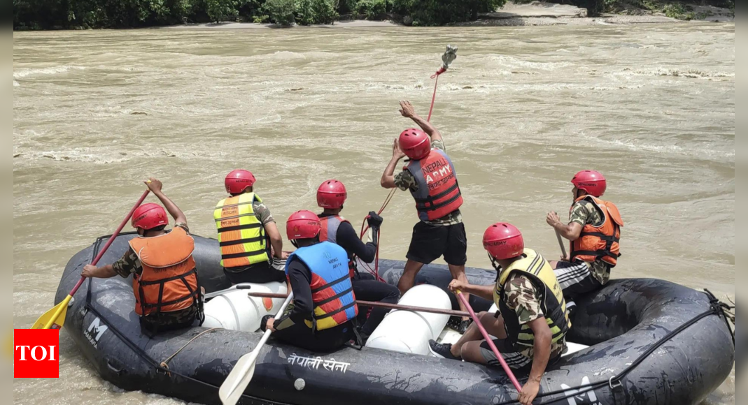 Nepal authorities say 65 people were on board the buses missing in a river since Friday – Times of India