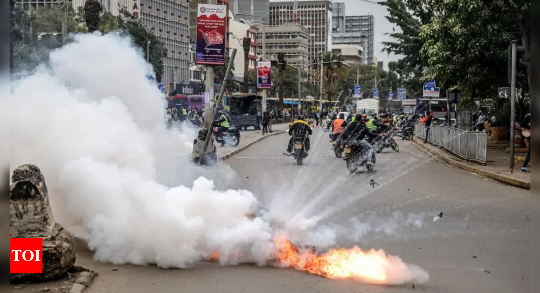 Kenya police fire tear gas as anti-government protesters burn tyres - Times of India