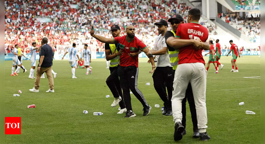 Watch: Olympic football kicks off to a violent and chaotic start as Morocco fans rush the field vs Argentina | Paris Olympics 2024 News - Times of India