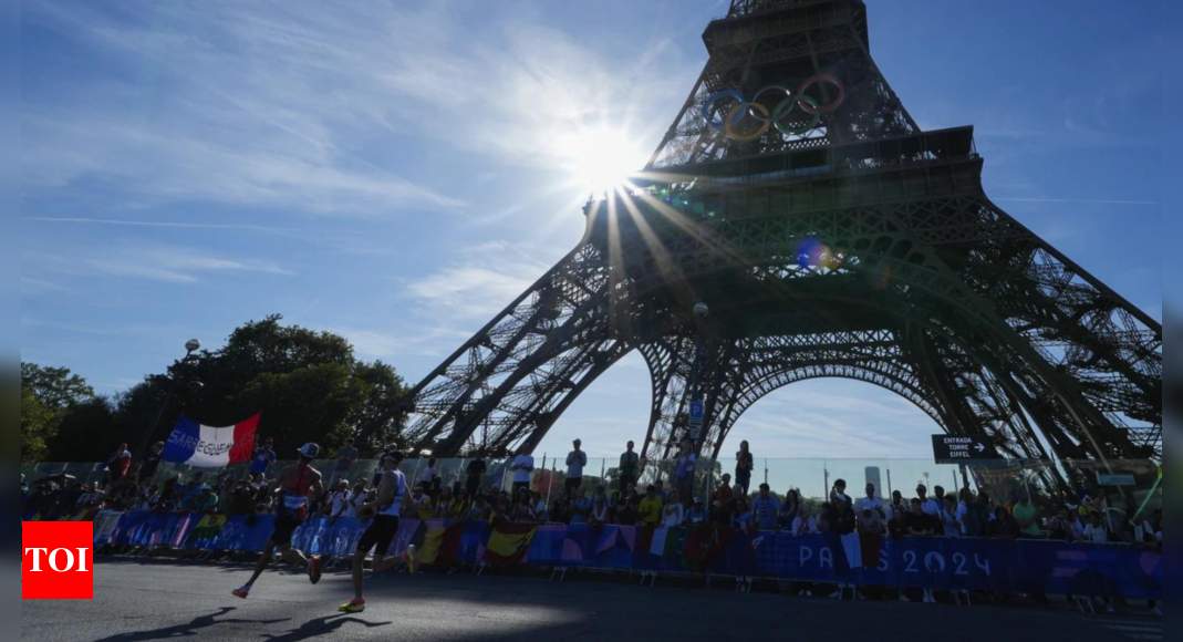 Eiffel Tower evacuated after man climbs up ahead of Paris Olympics closing ceremony – Times of India