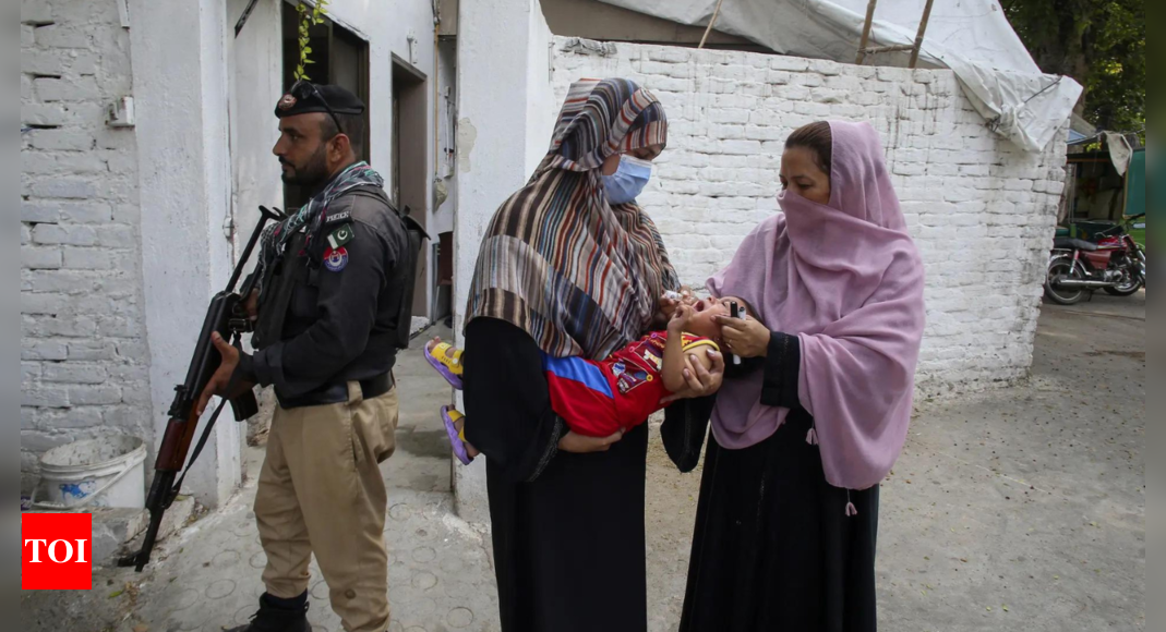 A roadside bomb hits a vehicle carrying police guarding an anti-polio drive in Pakistan, wounding 9 – Times of India