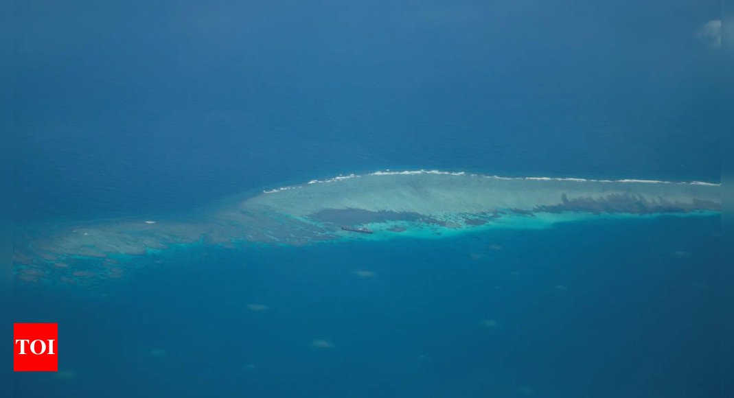 Philippines says 'we have not lost' South China Sea reef after pullout - Times of India