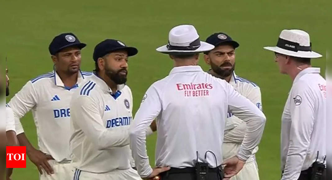 Tensions flare as Rohit Sharma, Virat Kohli engage in heated argument with umpires over bad light decision. Watch | Cricket News - Times of India